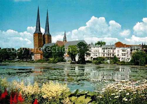 AK / Ansichtskarte Luebeck Uferpartie am Wasser Blick zur Kirche Kat. Luebeck