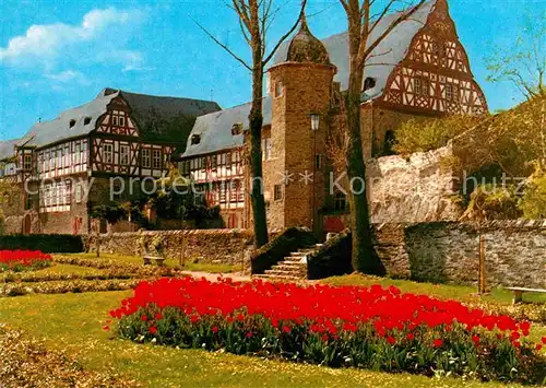 AK / Ansichtskarte Idstein Schlossgasse Blumenbeet Stadtmauer Fachwerkhaeuser Kat. Idstein