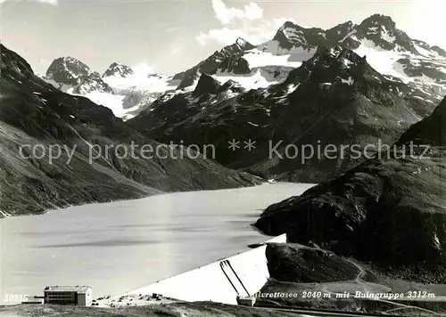 AK / Ansichtskarte Silvrettasee Bergsee Staumauer mit Buingruppe Kat. Silvretta