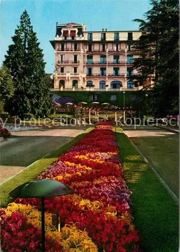 AK / Ansichtskarte Evian les Bains Haute Savoie Grand Hotel du Park Blumenbeet Kat. Evian les Bains