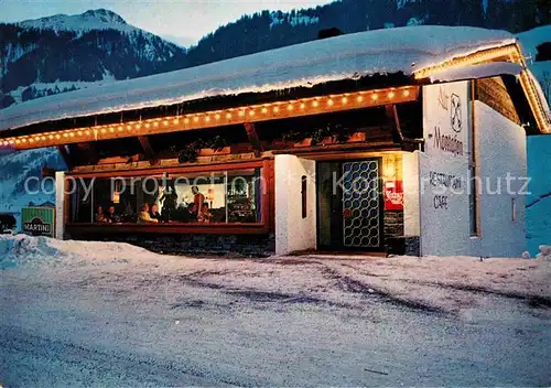 AK / Ansichtskarte Gaschurn Vorarlberg Restaurant Alt Montafon im Winter Nachtaufnahme Kat. Gaschurn