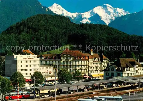 AK / Ansichtskarte Interlaken BE Bahnhofsplatz Moench Jungfrau Kat. Interlaken