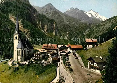 AK / Ansichtskarte Heiligenblut Kaernten Ortsansicht mit Kirche Blick zum Grossglockner Hohe Tauern Kat. Heiligenblut