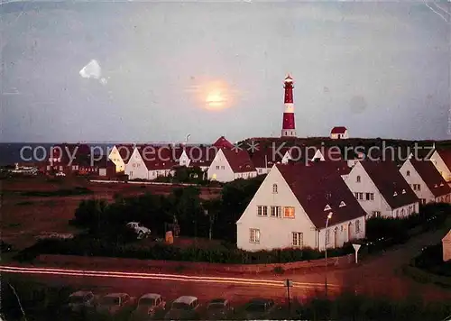 AK / Ansichtskarte Westerland Sylt Ortsansicht mit Leuchtturm bei Sonnenuntergang Kat. Westerland