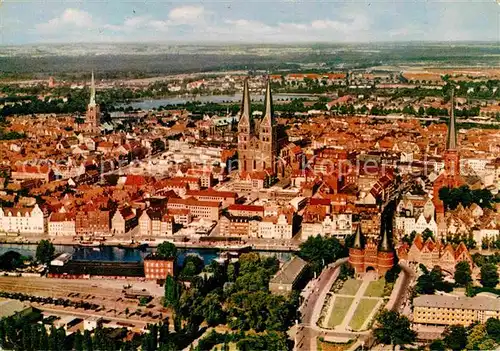 AK / Ansichtskarte Luebeck Stadtbild mit Holstentor Hansestadt Fliegeraufnahme Kat. Luebeck