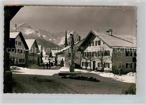 AK / Ansichtskarte Garmisch Partenkirchen Floriansbrunnen Winter Kat. Garmisch Partenkirchen