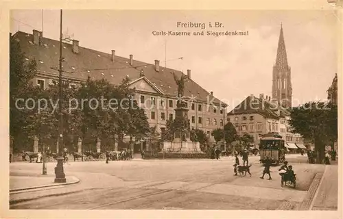 AK / Ansichtskarte Freiburg Breisgau Carls Kaserne mit Siegesdenkmal und Muensterturm Kat. Freiburg im Breisgau