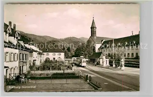 AK / Ansichtskarte Guenterstal Freiburg Kirche Strassenbahn Kiosk Kat. Freiburg im Breisgau