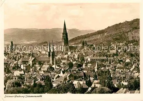 AK / Ansichtskarte Freiburg Breisgau Stadtpanorama mit Muenster Blick zum Schwarzwald Kat. Freiburg im Breisgau