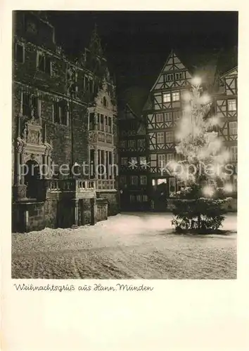 AK / Ansichtskarte Hann. Muenden Marktplatz zur Weihnachtszeit Christbaum Nachtaufnahme Kat. Hann. Muenden