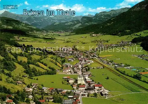 AK / Ansichtskarte Brixen Thale mit Kitzbueheler Horn Kitzbueheler Alpen Fliegeraufnahme Kat. Brixen im Thale