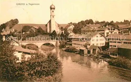 AK / Ansichtskarte Gmund Tegernsee Teilansicht mit Bruecke und Kirche Kat. Gmund a.Tegernsee