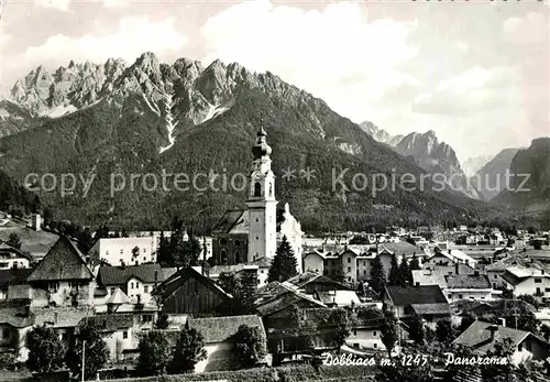 AK / Ansichtskarte Dobbiaco Pustertal Suedtirol Stadtbild mit Kirche Panorama Dolomiten Kat. Toblach Pustertal
