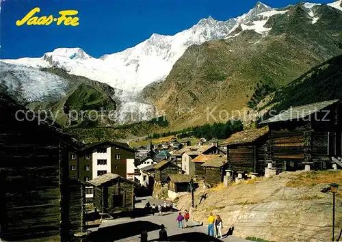 AK / Ansichtskarte Saas Fee Dorfansicht mit Blick zu Alphubel Taeschhorn Dorn und Lenzspitze Walliser Alpen Kat. Saas Fee