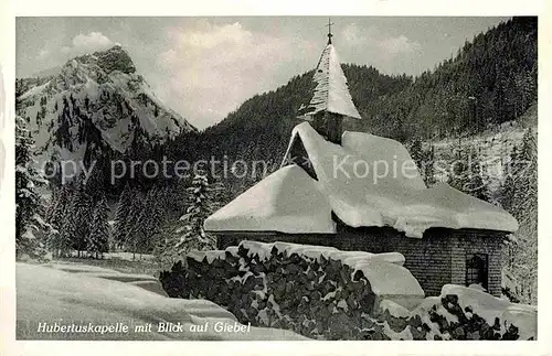 AK / Ansichtskarte Hinterstein Bad Hindelang Hubertuskapelle mit Blick auf Giebel Winterpanorama Alpen