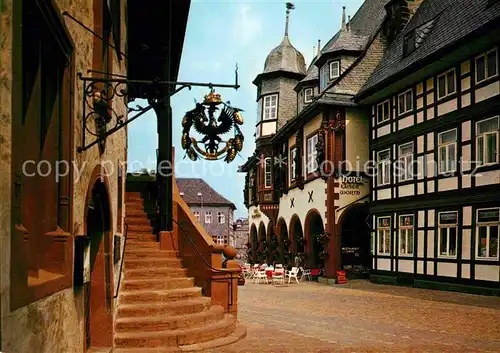 AK / Ansichtskarte Goslar Rathaustreppe Tuerschild Hotel Fachwerkhaus Kat. Goslar