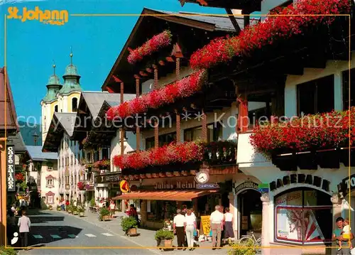 AK / Ansichtskarte St Johann Tirol Speckbacherstrasse Blumenschmuck Internationaler Sommerfrischort Kat. St. Johann in Tirol