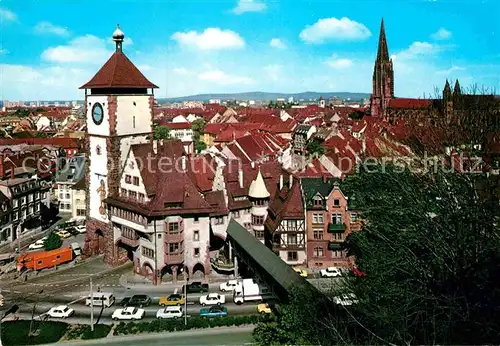 AK / Ansichtskarte Freiburg Breisgau mit Schwabentor und Muenster Kat. Freiburg im Breisgau