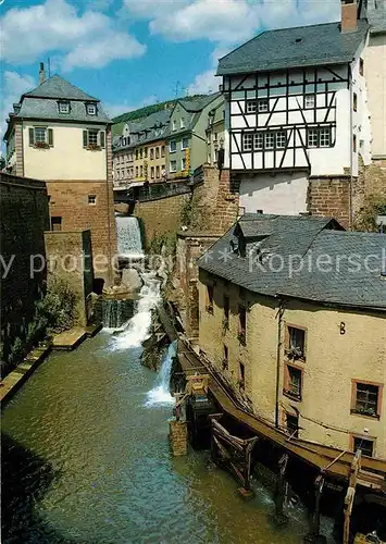 AK / Ansichtskarte Saarburg Saar Wasserfall des Leukbaches mit den alten Muehlen Kat. Saarburg