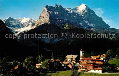 AK / Ansichtskarte Grindelwald Teilansicht mit Kirche Fiescherhoerner Eiger Berner Alpen Kat. Grindelwald