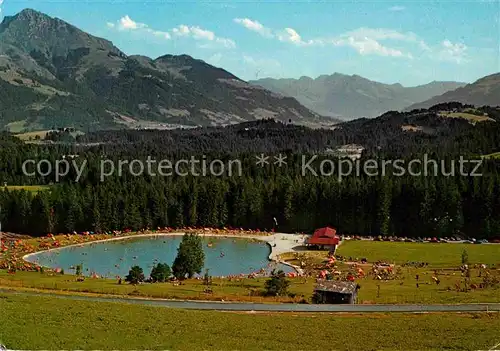 AK / Ansichtskarte Going Wilden Kaiser Tirol Sommerfrische Badesee gegen Kitzbueheler Horn Alpen Kat. Going am Wilden Kaiser