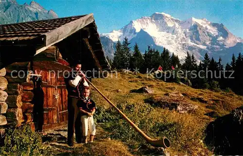 AK / Ansichtskarte Alphorn Alphornblaeser Sennenbub Jungfrau Wengen Kat. Musik