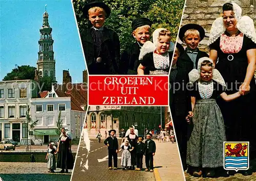 AK / Ansichtskarte Zeeland Niederlande Platz Kirchturm Trachten Familienfoto Kat. Niederlande