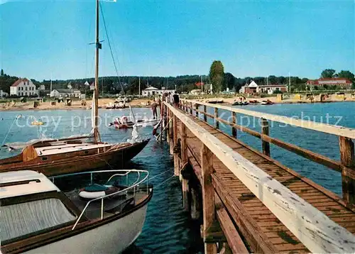 AK / Ansichtskarte Pelzerhaken Ostseebad Seebruecke Segelboot Strand