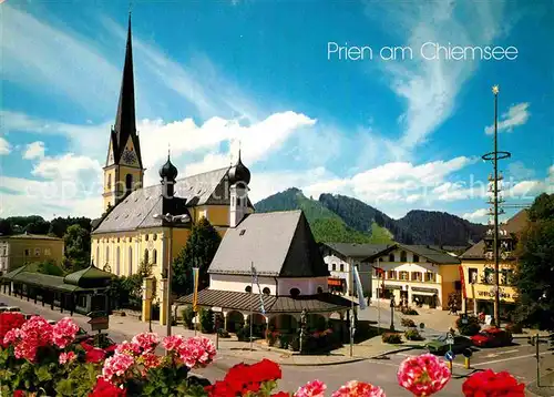 AK / Ansichtskarte Prien Chiemsee Ortspartie an der Kirche Maibaum Kat. Prien a.Chiemsee