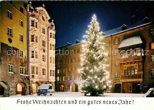 AK / Ansichtskarte Innsbruck Goldenes Dachl Christbaum Weihnachtskarte Nachtaufnahme Kat. Innsbruck