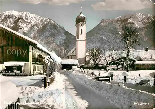 AK / Ansichtskarte Farchant Ortsmotiv mit Kirche Winterpanorama gegen Estergebirge Kat. Farchant