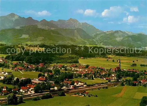 AK / Ansichtskarte uebersee Chiemsee Panorama Blick zur Kampenwand Chiemgauer Alpen Fliegeraufnahme
