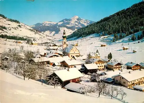 AK / Ansichtskarte Oberau Wildschoenau Tirol Ortsansicht mit Kirche Winterpanorama Alpen