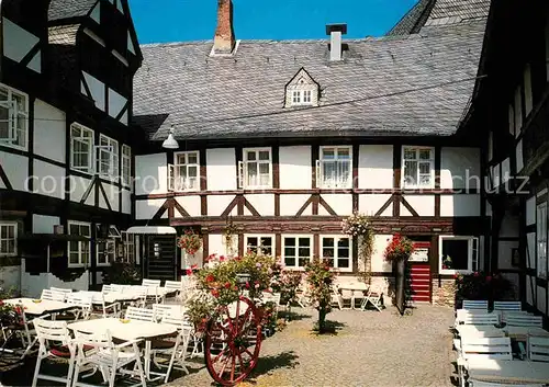 AK / Ansichtskarte Goslar Weisser Schwan in der Muenzstrasse Restaurant Zinnfiguren Museum Fachwerk Historisches Gebaeude Kat. Goslar