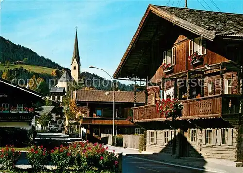 AK / Ansichtskarte Kirchberg Tirol Strassenpartie Kirche Kat. Kirchberg in Tirol