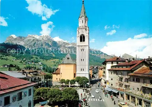 AK / Ansichtskarte Cortina d Ampezzo Ortsansicht mit Kirche Blick zum Tofane Massiv Dolomiten Kat. Cortina d Ampezzo