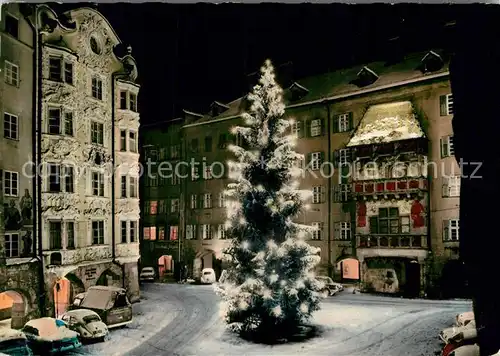AK / Ansichtskarte Innsbruck Helbinghaus Goldenes Dach im Winter Weihnachtsbaum Nachtaufnahme Kat. Innsbruck