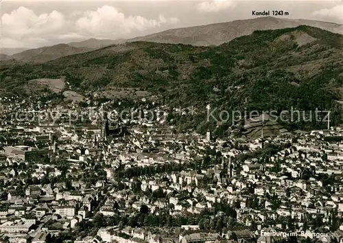 AK / Ansichtskarte Freiburg Breisgau Stadtpanorama mit Blick zum Kandel Schwarzwald Fliegeraufnahme Kat. Freiburg im Breisgau