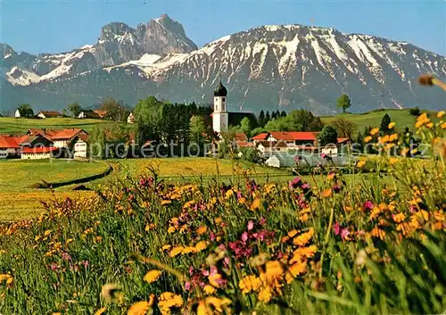 AK / Ansichtskarte Seeg Blumenwiese Ortsansicht mit Kirche Blick zu Aggenstein und Breitenberg Allgaeuer Alpen Kat. Seeg