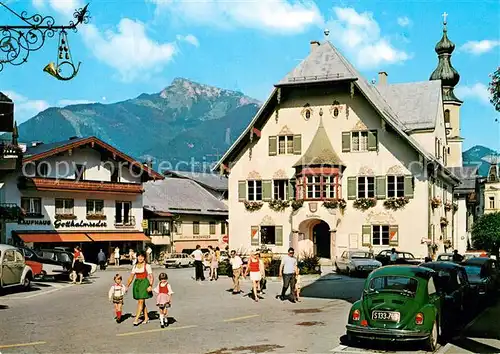 AK / Ansichtskarte St Gilgen Salzkammergut Rathaus Kaufhaus Blick zum Schafberg Kat. St Gilgen Wolfgangsee