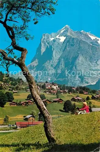 AK / Ansichtskarte Grindelwald Teilansicht mit Blick zum Wetterhorn Berner Alpen Kat. Grindelwald