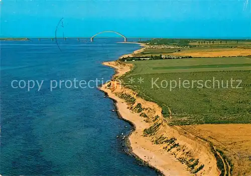 AK / Ansichtskarte Insel Fehmarn Steilkueste bei Wulfen mit Fehmarnsundbruecke Fliegeraufnahme Kat. Fehmarn