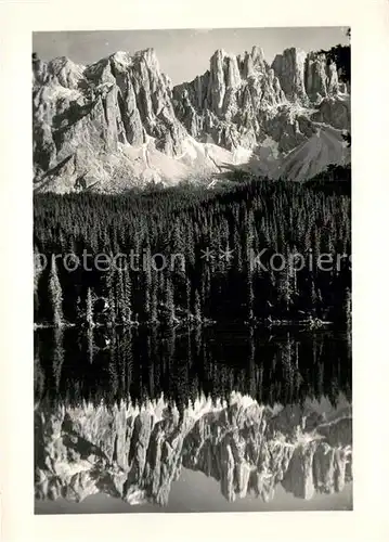 AK / Ansichtskarte Karersee Suedtirol gegen Latemar Dolomiten Bergsee Wasserspiegelung Kat. Welschnofen