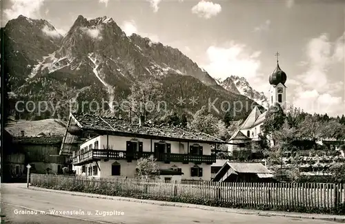 AK / Ansichtskarte Grainau Ortsmotiv mit Kirche Waxenstein Zugspitze Wettersteingebirge Kat. Grainau