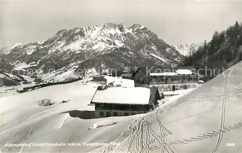 AK / Ansichtskarte Fieberbrunn Tirol Alpengasthof Laerchfilzhochalm Winterpanorama Alpen Kat. Fieberbrunn