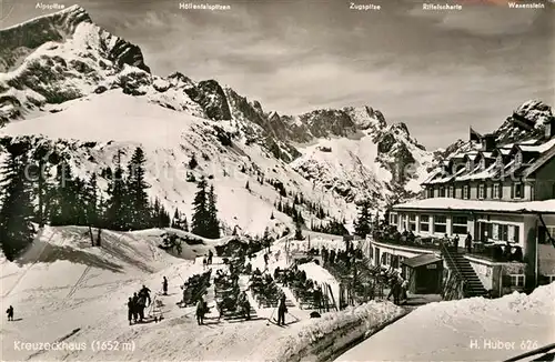 AK / Ansichtskarte Kreuzeckhaus Berghotel Restaurant Sonnenterrasse Wintersportplatz Alpen Kat. Garmisch Partenkirchen