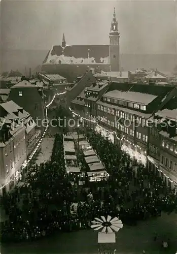 AK / Ansichtskarte Schneeberg Erzgebirge Marktplatz Kirche zur Weihnachtszeit Weihnachtsmarkt Kat. Schneeberg