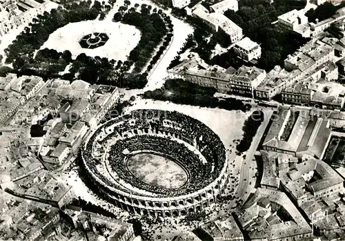 AK / Ansichtskarte Nimes Vue aerienne des Arenes Kat. Nimes