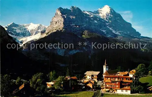 AK / Ansichtskarte Grindelwald Ortsansicht mit Kirche Fiescherhoerner Eiger Berner Alpen Kat. Grindelwald