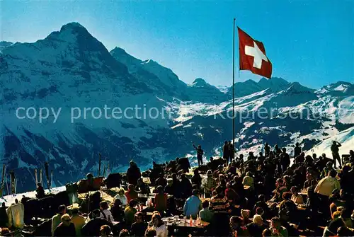 AK / Ansichtskarte Grindelwald Bergrestaurant First Sonnenterrasse Eiger Jungfrau Tschingelhorn Berner Alpen Schweizer Flagge Kat. Grindelwald